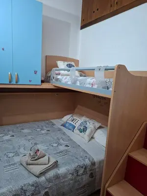 Letto o letti in una camera di Deliziosa casetta Calasetta