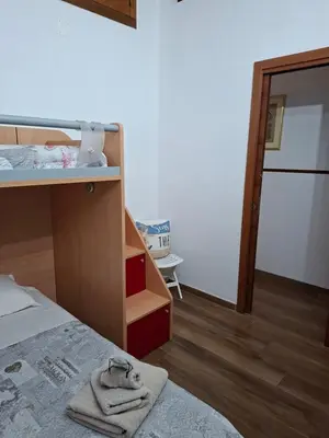 Letto o letti in una camera di Deliziosa casetta Calasetta