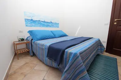Letto o letti in una camera di B&B Acquamarina Villasimius