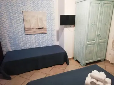 Letto o letti in una camera di B&B Acquamarina Villasimius
