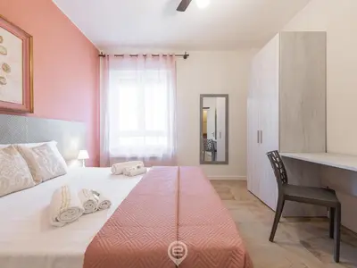 Letto o letti in una camera di Cagliari Diamond Apartment
