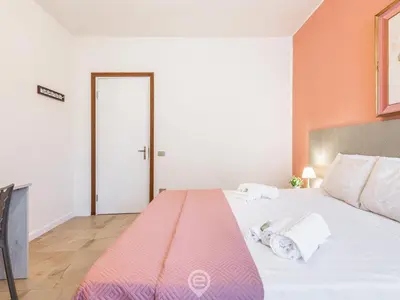 Letto o letti in una camera di Cagliari Diamond Apartment