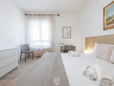 Letto o letti in una camera di Cagliari Diamond Apartment