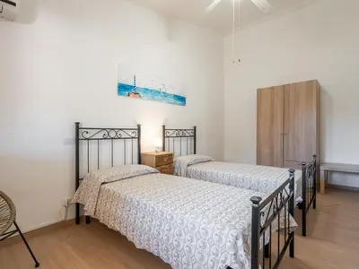 Letto o letti in una camera di Apartment Il Faro Blu by Interhome
