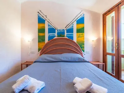Letto o letti in una camera di Holiday Home Luli by Interhome