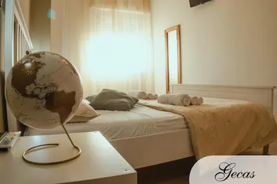 Letto o letti in una camera di DOMUS DEIANAS - two deluxe apartments in Cagliari