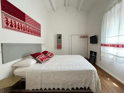 Letto o letti in una camera di Palazzo Ma.Ri.Lu.