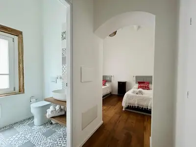 Letto o letti in una camera di Palazzo Ma.Ri.Lu.
