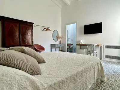 Letto o letti in una camera di Palazzo Ma.Ri.Lu.