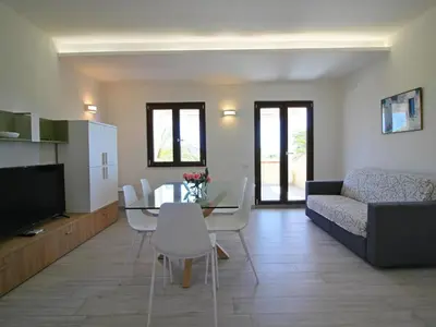 TV o dispositivi per l'intrattenimento presso Apartment on Costa Rei with Stunning Beaches