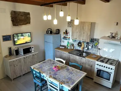 Cucina o angolo cottura di Il Rifugio del vecchio Bandito