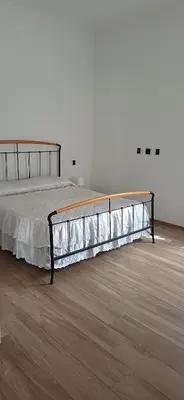 Letto o letti in una camera di A casa di Anna e Mario