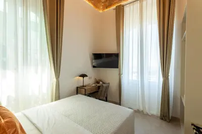 TV o dispositivi per l'intrattenimento presso Magnini Rooms