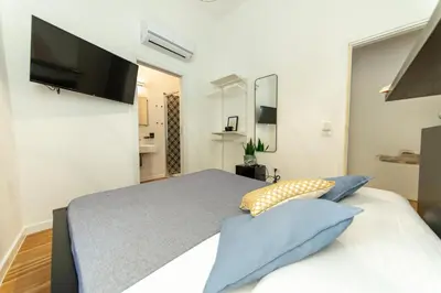 Letto o letti in una camera di Lele's Rooms