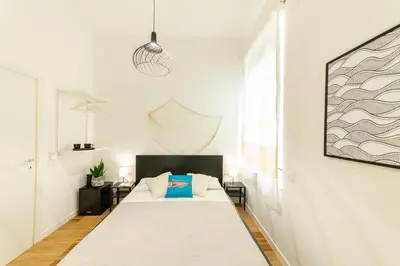 Letto o letti in una camera di Lele's Rooms