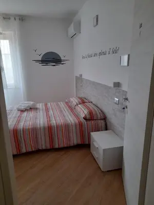 Letto o letti in una camera di Aer Sana