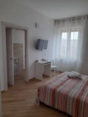 Letto o letti in una camera di Aer Sana