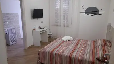 Letto o letti in una camera di Aer Sana
