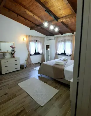 Letto o letti in una camera di La Corte Liberty Rosa