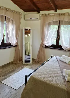 Letto o letti in una camera di La Corte Liberty Rosa