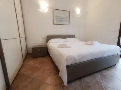Letto o letti in una camera di Al 28ᴀ , Appartamento Teulada