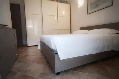 Letto o letti in una camera di Al 28ᴀ , Appartamento Teulada