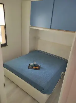 Letto o letti in una camera di holiday house 