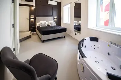 Letto o letti in una camera di CorsoVittorio87Suite