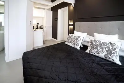 Letto o letti in una camera di CorsoVittorio87Suite