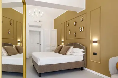 Letto o letti in una camera di CorsoVittorio87Suite