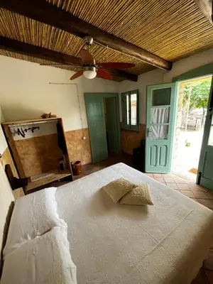 Letto o letti in una camera di Graziosa stanza campidanese Su segundu