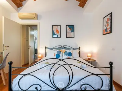 Letto o letti in una camera di La Terrazza della Marina