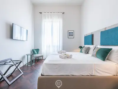 Letto o letti in una camera di Verso Suites