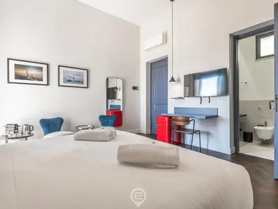 Letto o letti in una camera di Verso Suites