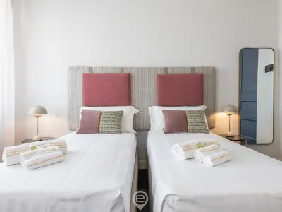 Letto o letti in una camera di Verso Suites