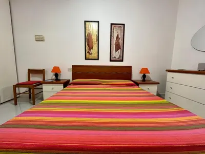 Letto o letti in una camera di Appartamento Teresa By La Via Del Mare Viaggi e Vacanze