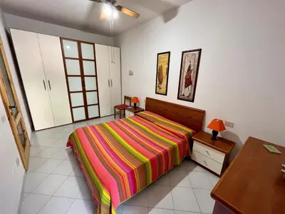 Letto o letti in una camera di Appartamento Teresa By La Via Del Mare Viaggi e Vacanze