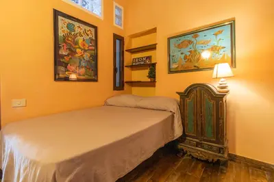 Letto o letti in una camera di LariBiancos Cagliari CENTRO STORICO