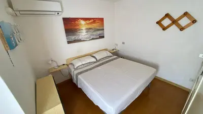 Letto o letti in una camera di Appartamento vista mare Buggerru