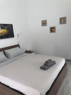 Letto o letti in una camera di Domus Alessia