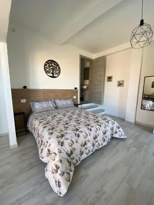 Letto o letti in una camera di Domus Alessia