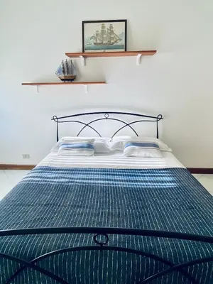Letto o letti in una camera di Acqua Chiara