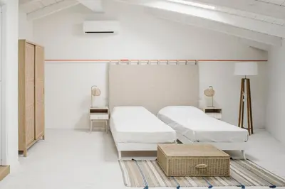Letto o letti in una camera di AltaMarea - Luce, spazi ampi e comfort al centro del paese