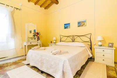 Letto o letti in una camera di Antica Dimora del Melograno