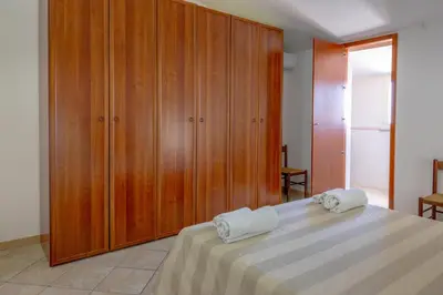 Letto o letti in una camera di Sestu house
