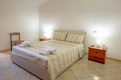 Letto o letti in una camera di Sestu house