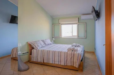 Letto o letti in una camera di Sestu house