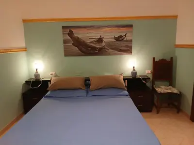 Letto o letti in una camera di Casa Cristoforo Colombo