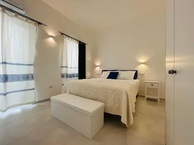 Letto o letti in una camera di Via Giardini Rooms