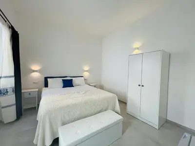Letto o letti in una camera di Via Giardini Rooms